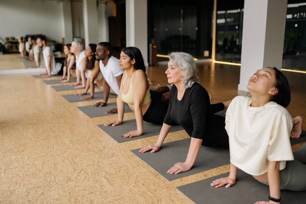 Group stretch class on studio mats
